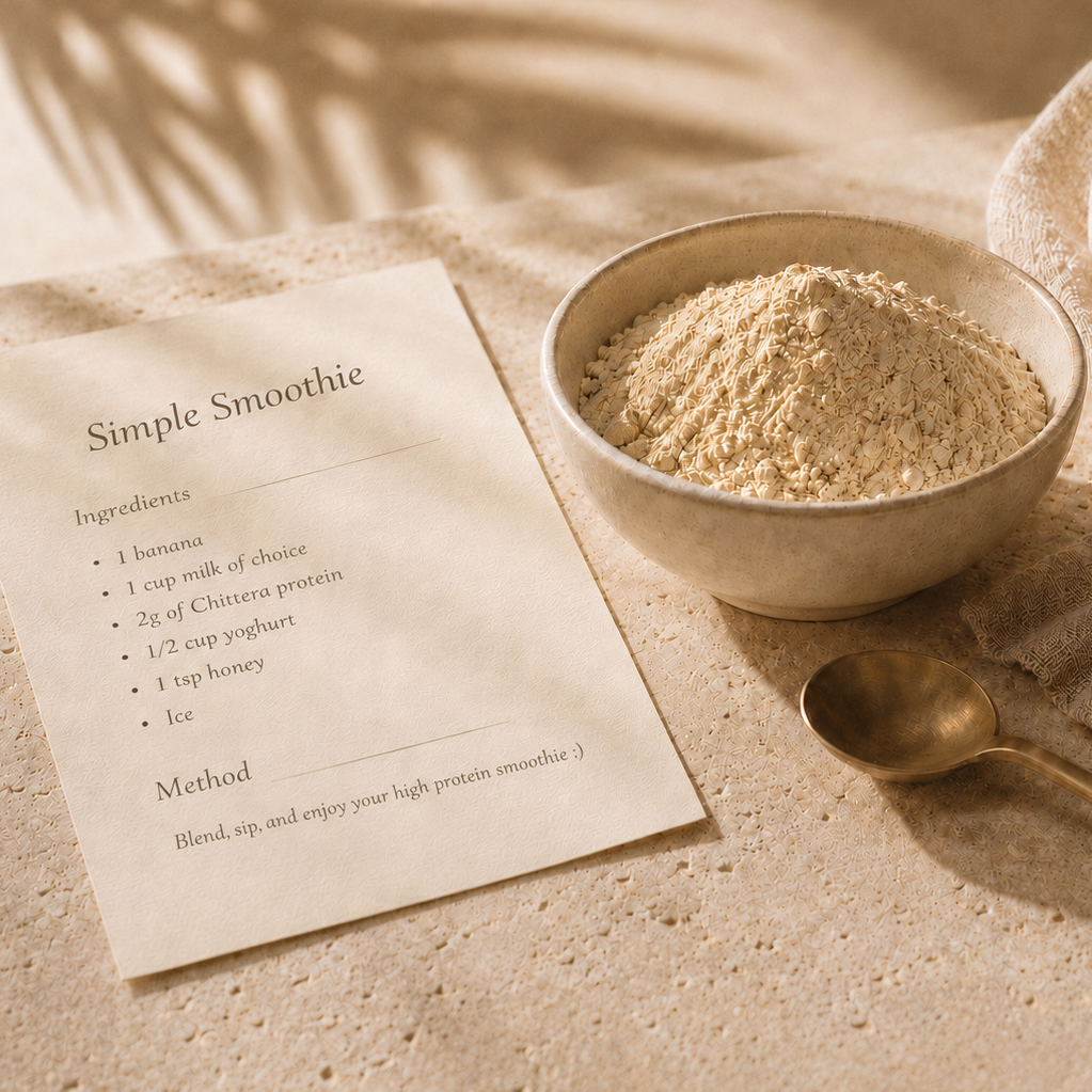 A bowl of Chittera protein powder beside a handwritten smoothie recipe card